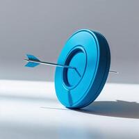 Bright blue target with silver arrow firmly struck in the center on a minimalist background photo