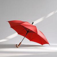 Bright red umbrella resting on an elegant background with soft light creating a serene atmosphere photo