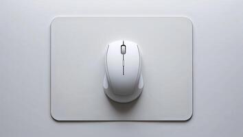 High-quality wireless mouse on a minimalist mouse pad in a modern workspace setup photo
