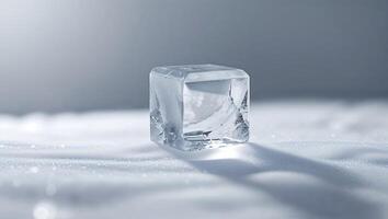 Melting ice cube on a smooth surface during natural light conditions in a calm environment photo