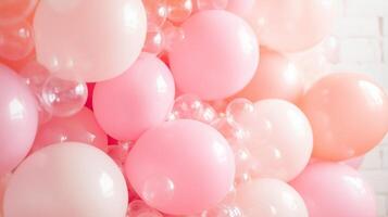 Colorful assortment of pink and clear balloons arranged for a festive celebration event photo