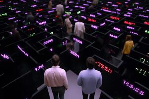 Two individuals observe a maze of digital data displays during an innovative technology event in a modern exhibition space photo