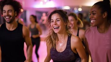 Group of friends enjoying a lively dance workout session in a fitness studio during evening hours photo