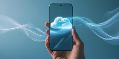 Hand holding smartphone displaying digital cloud technology with glowing effects in a blue background during evening hours photo
