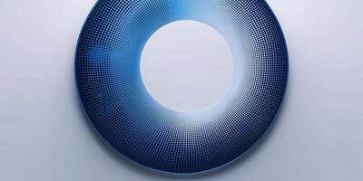 Intricate blue circular design showcasing a gradient pattern illuminated against a light background photo