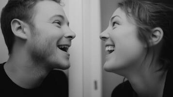 Happy couple sharing a joyful moment together while laughing in a cozy indoor setting photo