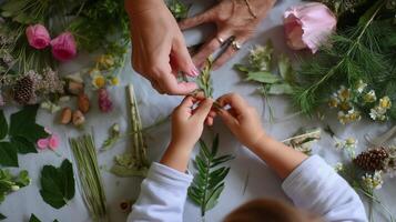 Creating nature crafts with flowers and leaves in a cozy indoor setting photo