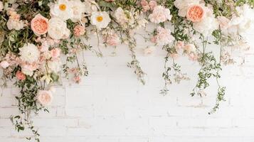 Beautiful floral arrangement with peonies and roses against a white brick wall in a bright setting photo