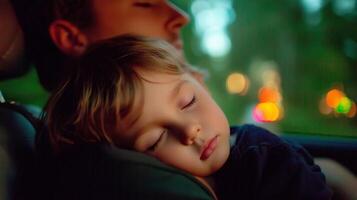 Father and son enjoy a peaceful moment of sleep together in car during sunset on a summer evening in the city photo