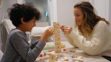 Family bonding time during a fun game of stacking blocks at home in the evening photo