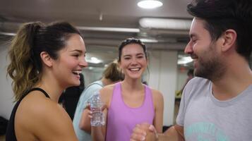 Friends share laughter and motivation during a workout session in a modern gym after an intense fitness class photo