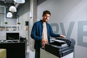 Printing documents in a modern office while smiling in a casual outfit photo