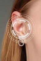 Close-up view of an elegant earring displayed in a contemporary studio setting during a fashion showcase photo