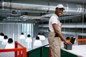Worker enjoys task in modern workspace with bright lighting during daytime photo