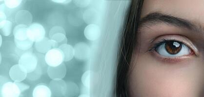 Bright and captivating eye with a unique reflection in a blurred background of sparkling lights photo
