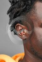 Sound waves and human connection captured in a close-up of an ear highlighting auditory perception and culture photo