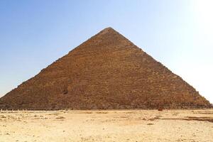 Majestic pyramid stands tall under bright sky at Giza, showcasing ancient Egyptian architecture and history photo