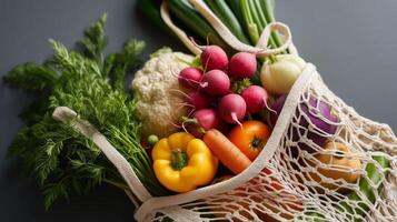 Fresh vegetables in a reusable bag at a kitchen counter ready for cooking photo