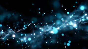Bright blue particles float in a dark space creating an abstract cosmic background photo