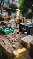 Variety of electronic components and tools displayed on a wooden workbench during a creative workshop session photo