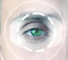 Close-up view of a human eye with digital scanning effects representing biometric technology photo