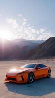 Bright orange sports car parked in an expansive desert landscape under a clear sky during sunset photo