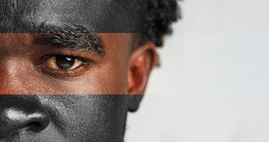 Close-up of a man's face showing expression and emotion with focus on his intense eye and detailed facial features photo
