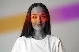 Portrait of a young woman with vibrant color accents in a minimalist studio setting, captured during afternoon light photo