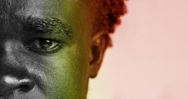 Portrait of a man with intense gaze showcasing emotions and depth in artistic black and white with color highlights photo