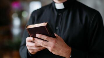 Clergy member holding an ancient book during a quiet moment of reflection in a serene environment photo
