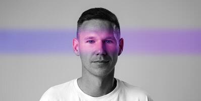 Bright abstract portrait of a man with a playful color scheme in a minimalist setting photo