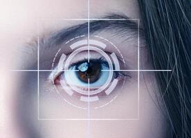 Close-up of a human eye with a digital scanning overlay indicating biometrics and technology in use photo