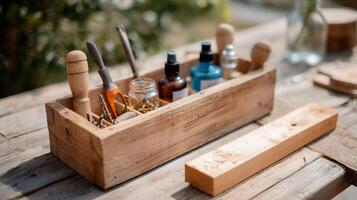 Wooden tool organizer filled with various bottles and instruments on a rustic table in a garden setting during daylight hours photo