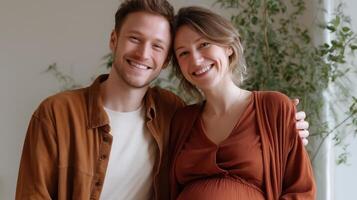 Couple joyfully celebrates parenthood with a loving embrace in a cozy indoor setting during pregnancy photo