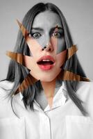 Woman expresses shock with artistic overlay emphasizing emotion in a monochrome and color contrast scene photo