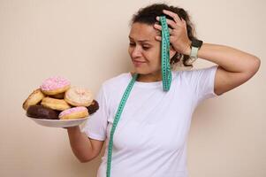 Woman Choosing Between Tasty Doughnuts and Healthy Options Reflecting Wellness Decisions and Food Choices photo