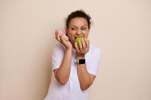 Health-Conscious Choice Concept Depicting a Woman Ambiguously Choosing Between a Green Apple and a Donut in a Humorous and Expressive Way photo