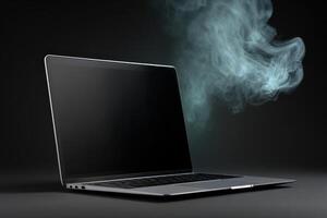 Laptop emits smoke in dark environment indicating malfunction and potential danger photo