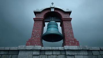 Historic bell tower with a large bell under a cloudy sky at sunset photo