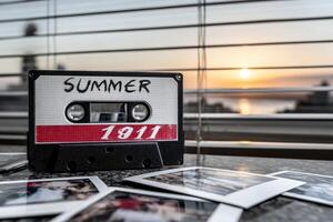 Nostalgic summer memories captured on a cassette and photographs at sunset photo