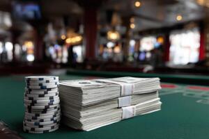 Stacks of cash and poker chips on a casino table after a successful game night photo