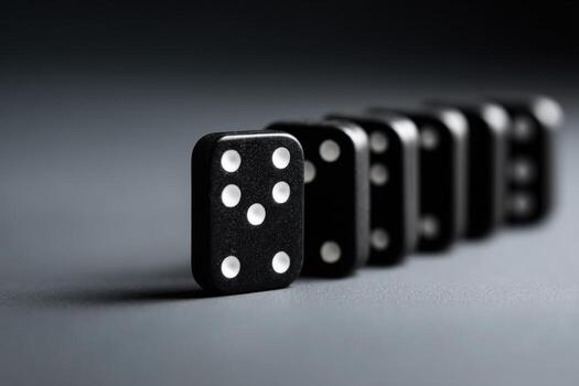 Dominoes lined up on a smooth surface creating a striking visual effect photo