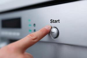 User initiates the cooking process by pressing the start button on a modern kitchen appliance photo