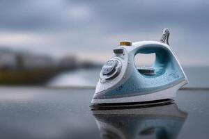 Iron resting on a wet surface with a cloudy background near a coastline photo