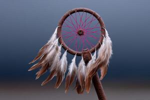 Bike wheel transformed into a colorful dreamcatcher with feathers on a soft background photo