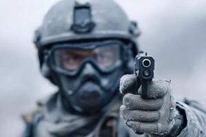 Soldier in tactical gear aims sidearm during winter training exercise in a remote location photo