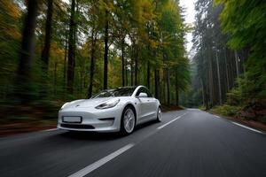 Car drives through a vibrant forest surrounded by towering trees in autumn photo