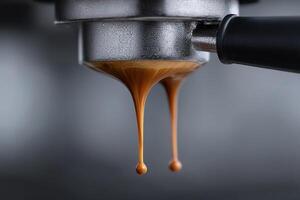 Espresso drips from coffee machine during brewing process in a cafe setting photo