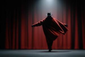 Old theater actor performs dramatically in front of red curtains under spotlight photo