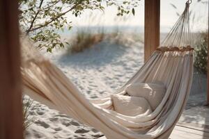 Chic beige hammock with cushions set against a serene beach background in sunlight photo
